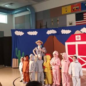 Andrea Watts / The Daily World
The Barnyard Chorus, consisting of a sheep, pigs, chicken, ponies, donkey, and cow, perform a song with Buck (Ellis).