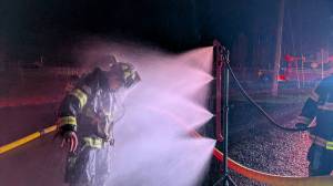 East Grays Harbor Fire and Rescue
An East Grays Harbor Fire and Rescue firefighter is washed down after firefighting efforts in Elma.
