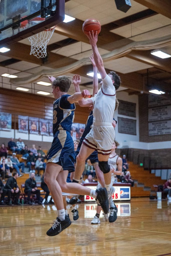 PHOTO BY FOREST WORGUM Montesanos Colton Grubb (right) puts up a shot during a 48-34 victory over Cedar Park Christian on Monday at Montesano High School.