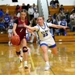 RYAN SPARKS | THE DAILY WORLD Hoquiam guard Avery Brodhead (1) steals the ball away from Elma senior Olivia Moore during the Grizzlies 51-38 win on Tuesday at Elma High School.