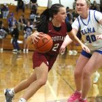 RYAN SPARKS | THE DAILY WORLD Hoquiam guard Lexi LaBounty (2) drives to the hoop against Elmas Killie Vest during the Grizzlies 51-38 win on Tuesday at Elma High School.