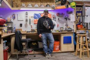 Owen Sexton photos / The Chronicle
KTMK Gloves founder Ken Ervin poses for a photo inside his Aberdeen garage on Thursday, Jan. 29, sporting his custom glove he made for his own personal use.