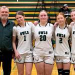 PHOTO COURTESY OF KRISTIN MASTELLER Mary M. Knight seniors (from left) Cloey Fletcher, Maelynn Nygaard, Carissa Reeves and Andiana Ziegler pose for a photo with head coach Jake Goldy ahead of a 46-39 Senior Night victory over Oakville on Wednesday in Matlock.
