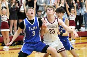 RYAN SPARKS | THE DAILY WORLD Elmas Isaac McGaffey (3) and Montesanos Caden Grubb (23) compete for a rebound during the Bulldogs 54-32 victory on Friday at Montesano High School. With the win, Montesano earned the No. 1 playoff seed in the 1A Evergreen League.