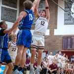 PHOTO BY FOREST WORGUM Montesanos Ryan Weidman (12) hits a jump shot while defended by Elmas Dylan Myer during the Bulldogs 54-32 victory on Friday at Montesano High School.