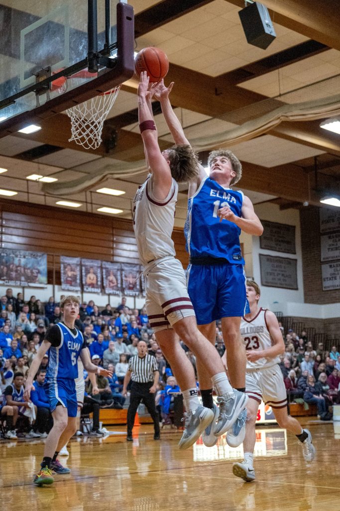 PHOTO BY FOREST WORGUM Elmas Dylan Myer (right) defends against Montesanos Ryan Weidman during the Eagles 54-32 loss on Friday at Montesano High School.
