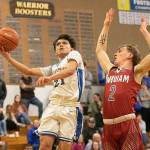DYLAN WILHELM | THE CHRONICLE Hoquiams Ethan Byron (2) defends Rochesters Tyson Canales during the Grizzlies 52-40 win on Friday at Rochester High School.
