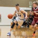 DYLAN WILHELM | THE CHRONICLE Hoquiams Ryker Maxfield (right) guards Rochesters Clayton Knutson during the Grizzlies 52-40 win on Friday at Rochester High School.