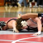 PHOTO BY SUE MICHALAK BUDSBERG Hoquiams Junior Balagot (left) competes against Montesanos Finley Ekerson during the 120-pound title match at the 1A Evergreen League Championship Meet on Saturday at Hoquiam High School.