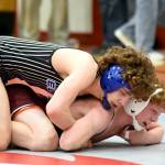 PHOTO BY SUE MICHALAK BUDSBERG Elmas Aidyn Johnson (top) controls Montesanos Hank Erickson during the 126-pound title match at the 1A Evergreen League Championship Meet on Saturday at Hoquiam High School.