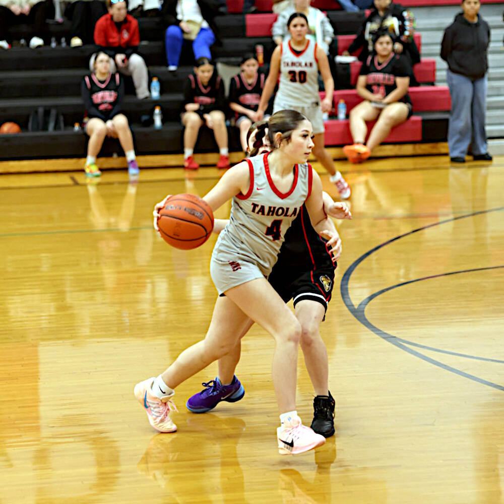 PHOTO BY TIA CHENEY Taholahs Aunnie Markishtum (4) dribbles against Oakville during a 71-25 1B District 4 Tournament victory on Tuesday in Taholah.