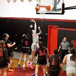 PHOTO BY TIA CHENEY Taholahs Noelani McCrory (middle) scores two of her 14 points in a 71-25 win over Oakville in a 1B District 4 Tournament game on Tuesday in Taholah.