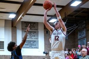 PHOTO BY FOREST WORGUM
Montesano's Ryan Weidman (12) puts up a jump shot during a 75-56 win over La Center in a 1A District 4 Tournament game on Thursday in Montesano.