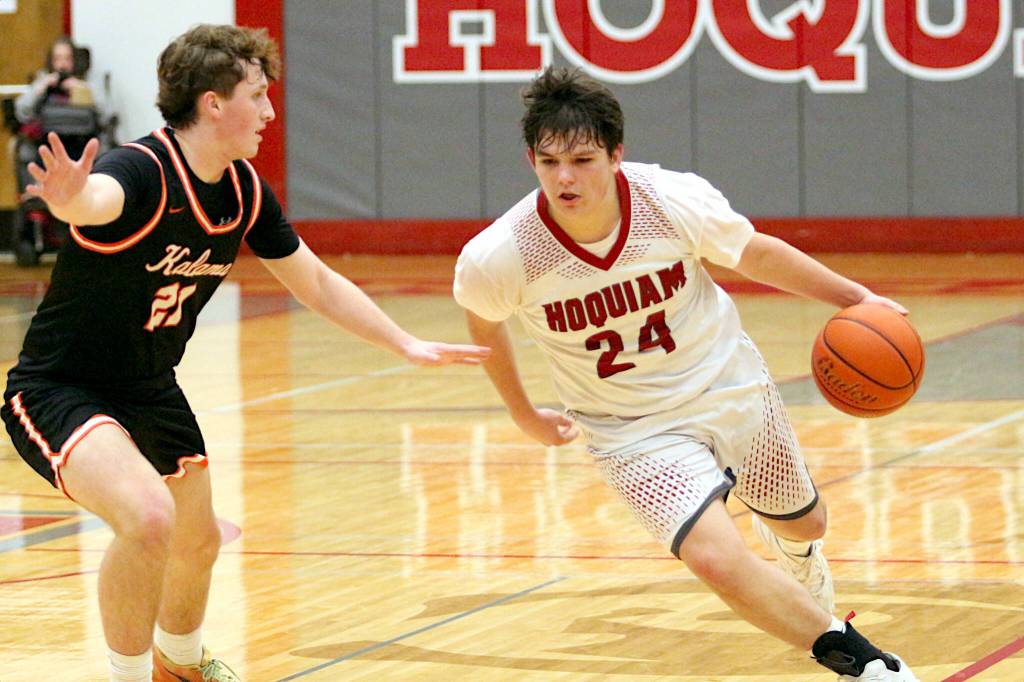 RYAN SPARKS | THE DAILY WORLD Hoquiam guard Lincoln Niemi (24) looks for space against Kalams Talan Thomas during a 48-39 loss in a 1A District 4 Tournament game on Thursday at Hoquiam High School.