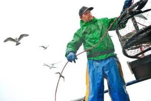 Riley Yuan photos
Cody Luman, a deckhand, coils a line aboard the fishing vessel Marcus David.