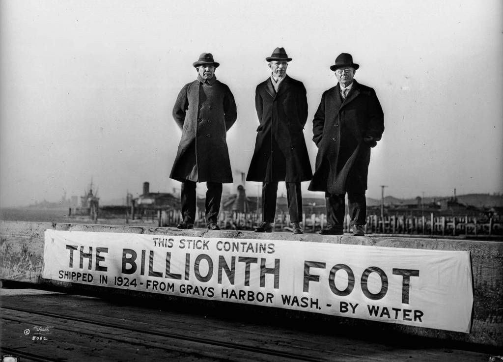 Jones Historical Collection
Port Commissioner Frank H. Lamb, center; County Commissioner C.N. Wilson, right, and Lytle Logging Company official L.W. Taft celebrate the billionth board foot of lumber shipped from the Port of Grays Harbor in 1924.