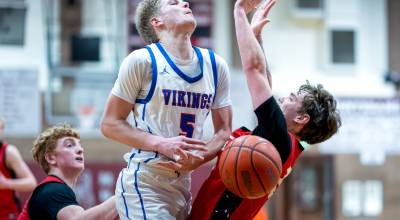 PHOTO BY MATT RUMBLES 
Willapa Valleys Brody Aust (5) collides with a Wahkiakum player during the Vikings 63-60 loss in the 1B District 4 championship game on Saturday at Montesano High School.
