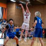 PHOTO BY FOREST WORGUM 
Hoquiams Joey Bozich (4) puts up a shot while Elmas JanCarlos Moreno (12) and Tanner Moe (2) defend during the Grizzlies 70-67 loss in a 1A District 4 elimination game on Saturday in Centralia.