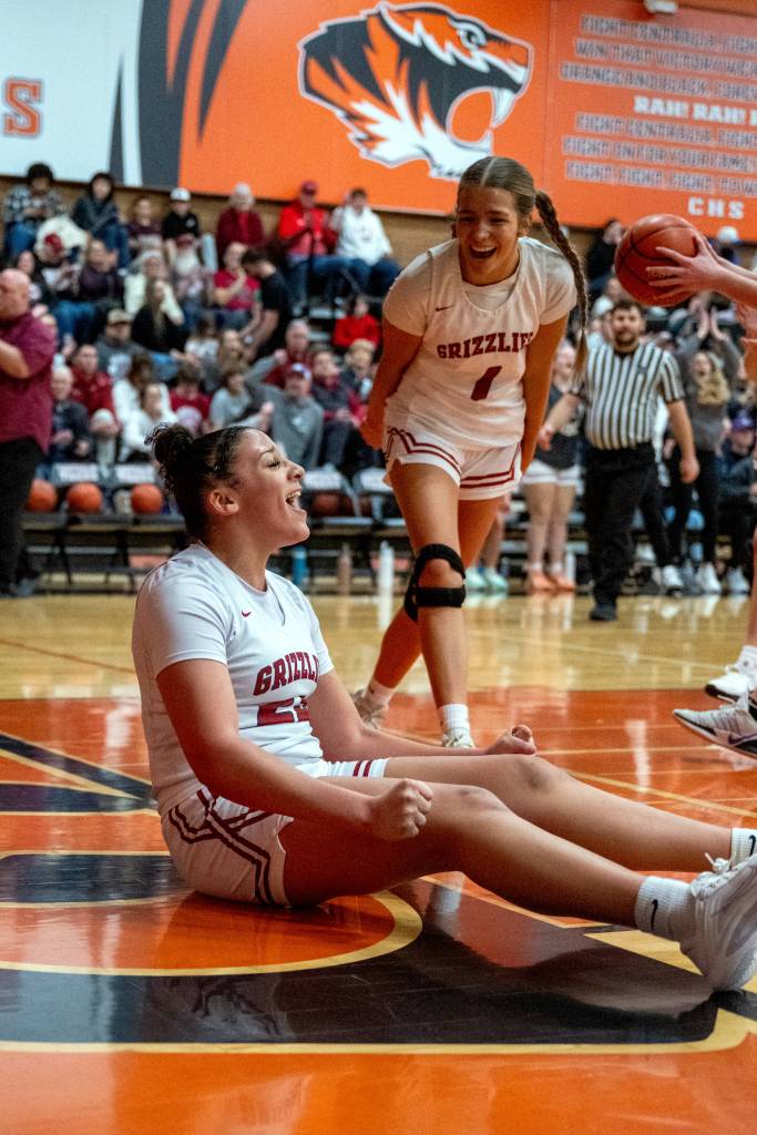 PHOTO BY FOREST WORGUM 
Hoquiams Aaliyah Kennedy (foreground) and Avery Brodhead celebrate a Kennedy basket during a 35-32 win over Elma in a 1A District 4 elimination game on Saturday at Centralia High School.