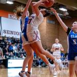 PHOTO BY FOREST WORGUM 
Hoquiams Aaliyah Kennedy (right) drives the basket against Elmas Mercedes Carter (left) and Mikayla Roberts (5) during the Grizzlies 35-32 victory in a 1A District 4 elimination game on Saturday at Centralia High School.