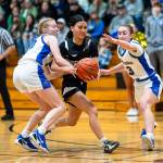 PHOTO BY MATT RUMBLES Raymond-South Bends Megan Kongbouakhay (middle) works through the Adna defense during the Ravens 57-34 loss in the 2B District 4 third-place game on Tuesday at W.F. West High School.