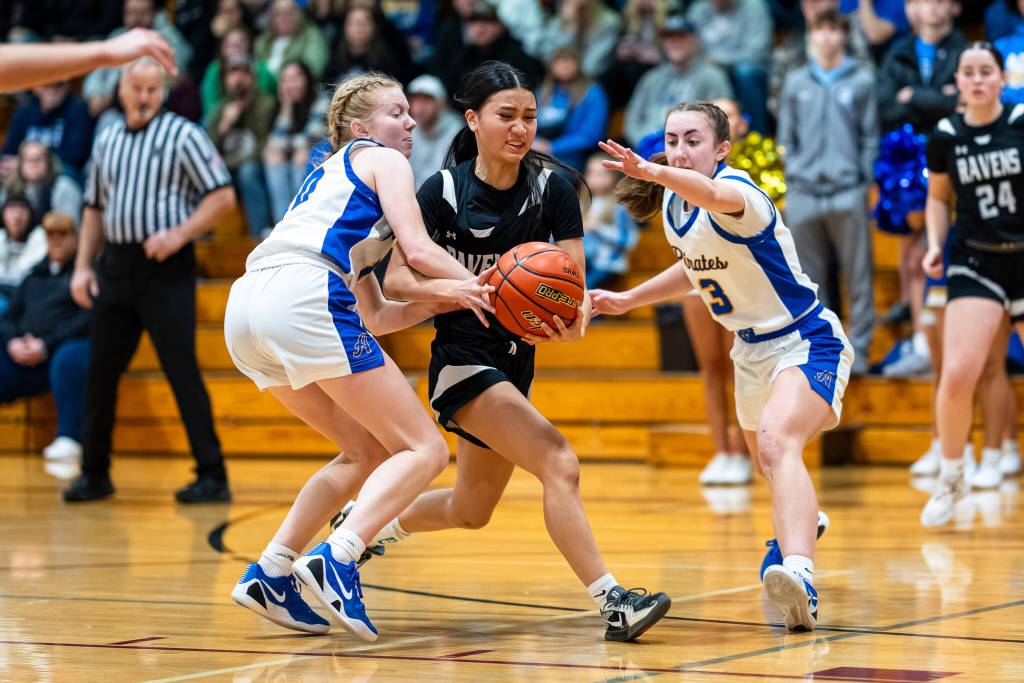 PHOTO BY MATT RUMBLES Raymond-South Bends Megan Kongbouakhay (middle) works through the Adna defense during the Ravens 57-34 loss in the 2B District 4 third-place game on Tuesday at W.F. West High School.