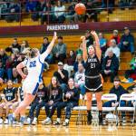 PHOTO BY MATT RUMBLES Raymond-South Bends Kassie Koski (21) shoots while Adnas Kamryn Freeman defends during the Ravens 57-34 loss in the 2B District 4 third-place game on Tuesday at W.F. West High School.