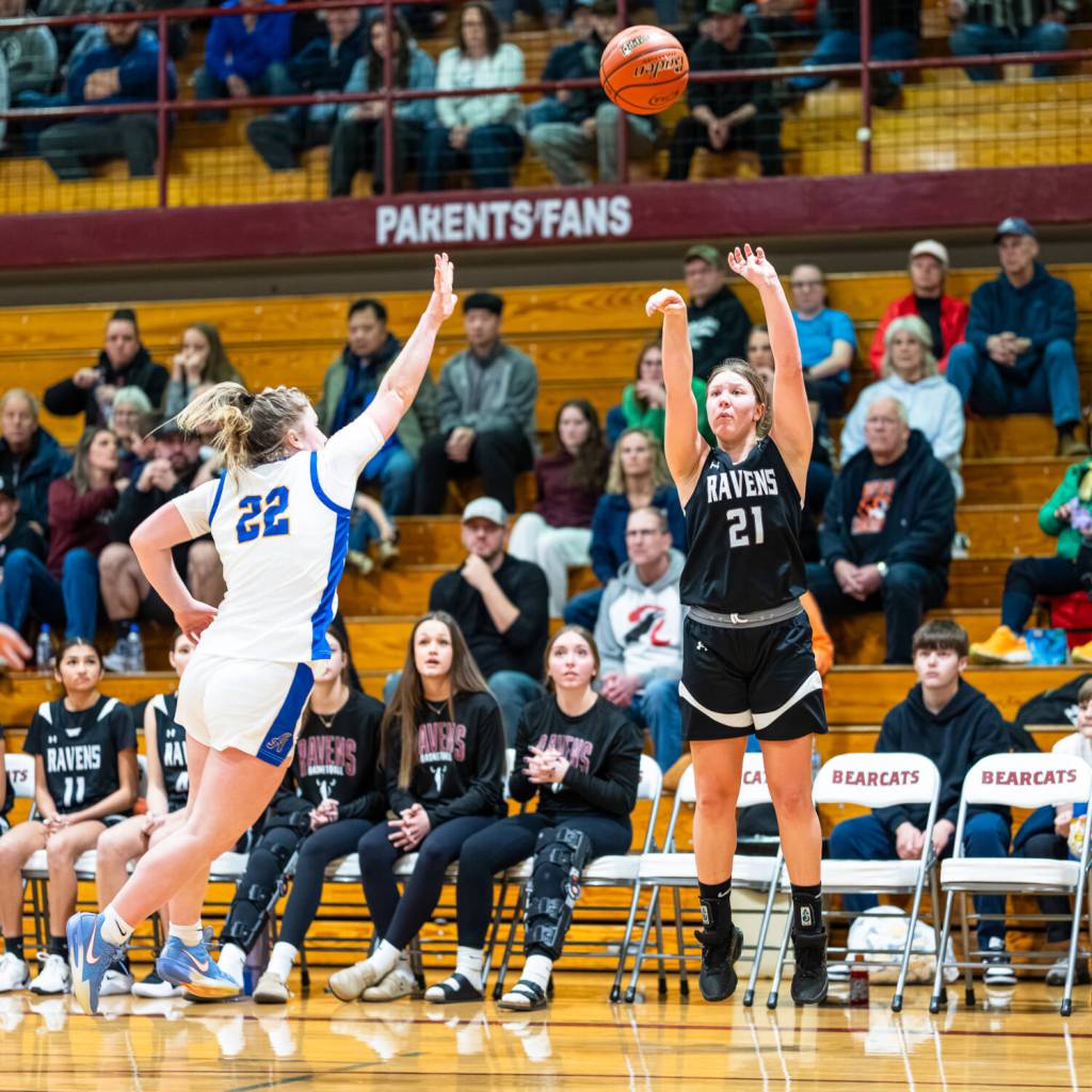 PHOTO BY MATT RUMBLES Raymond-South Bends Kassie Koski (21) shoots while Adnas Kamryn Freeman defends during the Ravens 57-34 loss in the 2B District 4 third-place game on Tuesday at W.F. West High School.
