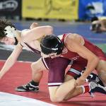 PHOTO BY SUE MICHALAK BUDSBERG Montesanos Finley Ekerson and Hoquiams Junior Balagot wrestle in a 120-pound semifinal match at the Mat Classic XXXVII state tournament on Saturday in Tacoma.