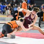 PHOTO BY SUE MICHALAK BUDSBERG Montesanos Gage Stutesman (right) wrestles against Cashmeres Jance Novack in the 165-pound championship match at the Mat Classic XXXVII state tournament on Saturday in Tacoma.