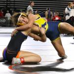 ERICA MCCRORY | MCCRORY PHOTOGRAPHY Aberdeens Xela Kowoosh (right) controls Ridgeways Llllian Hulegaard during a 2A 125-pound quarterfinal match at the Mat Classic XXXVII state tournament on Saturday at the Tacoma Dome.