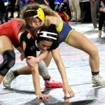 ERICA MCCRORY | MCCRORY PHOTOGRAPHY Aberdeen freshman Xela Kowoosh (top) controls Steliacooms Nadia Winn during the 2A 125-pound state-championship match at the Mat Classic XXXVII on Saturday at the Tacoma Dome.