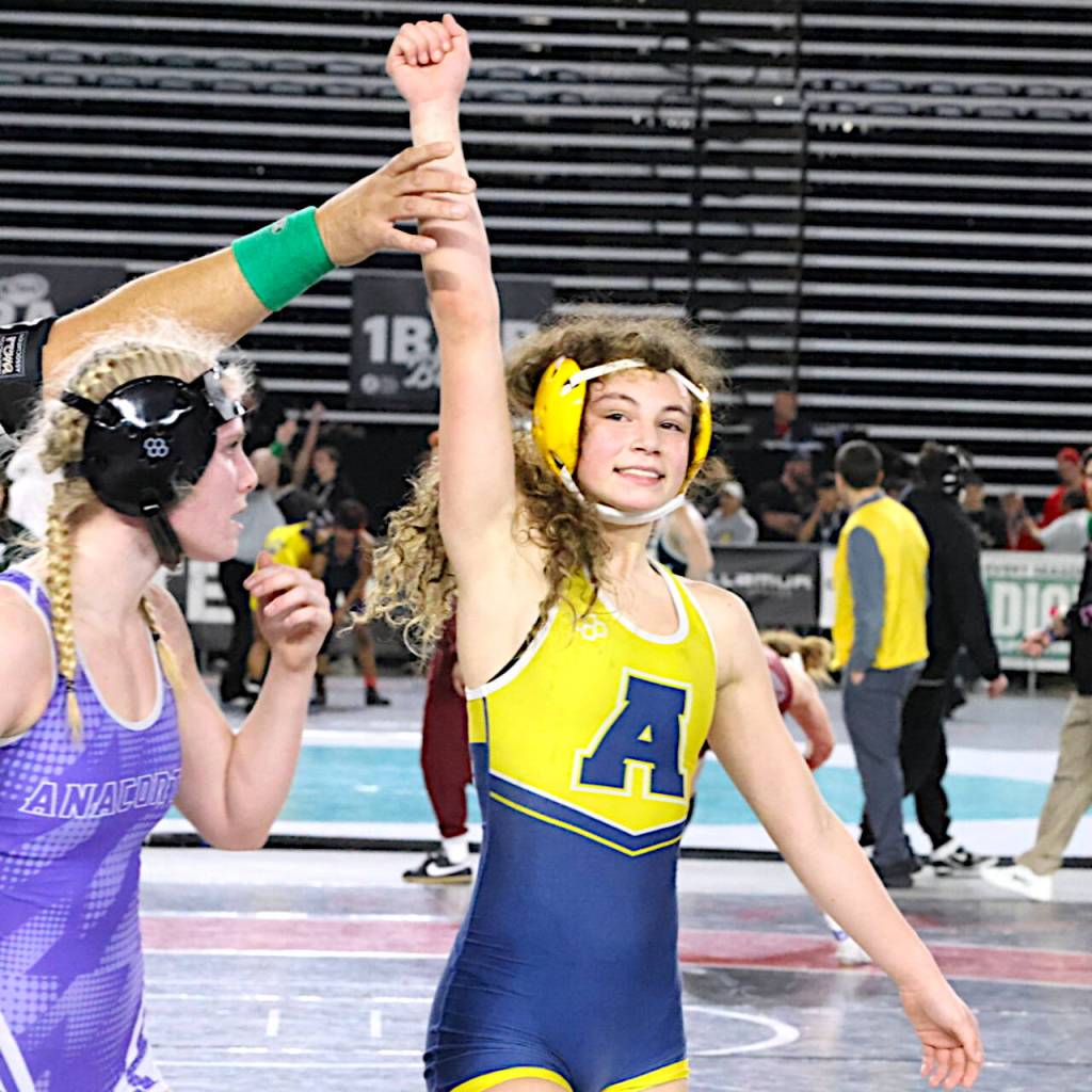 ERICA MCCRORY | MCCRORY PHOTOGRAPHY Aberdeen freshman Xela Kowoosh (right) is all smiles after advancing to the state-title match at the Mat Classic XXXVII state tournament on Saturday at the Tacoma Dome.