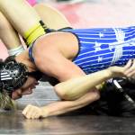 PHOTO BY SUE MICHALK BUDSBERG Elmas Xavier Espinoza (top) works to pin Vashon Islands Taevin Gilbert during a 132-pound match at the Mat Classic XXXVII on Friday at the Tacoma Dome. Espinoza won his second-consecutive state championship on Saturday.