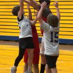 Central 5th grader Caden Evanger puts up a shot over Reggie Ward from Lincoln in the championship game. (The Daily World)