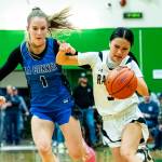PHOTO BY MATT RUMBLES 
Raymond-South Bends Megan Kongbouakhay (right) fights off La Conner defender Maeve McCormick during the Ravens 50-40 win in a 2B State Tournament first-round game on Saturday at Tumwater High School.