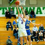 PHOTO BY MATT RUMBLES Willapa Valleys Brody Aust (5) scores on a layup while defended by Columbia Adventists Tristan White during the Vikings 63-60 loss in a 1B State Tournament game on Saturday at Tumwater High School.