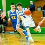 PHOTO BY MATT RUMBLES Willapa Valleys Blane King (3) dribbles against Columbia Adventists Luke Pierce during the Vikings 63-60 loss in a 1B State Tournament game on Saturday at Tumwater High School.