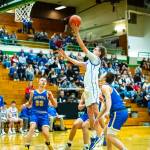 PHOTO BY MATT RUMBLES Willapa Valleys J.B. Russell (right) glides to the hoop during a 63-60 loss to Columbia Adventist in a 1B State Tournament game on Saturday at Tumwater High School.