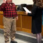 Jerry Knaak / The Daily World
New Ocean City Drainage District Commissioner Jon Schleiger takes his oath of office administered by Grays Harbor County Commissioner Vickie Raines.