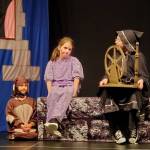 Andrea Watts / The Daily World
In Sleeping Beauty, Makenna Casey (Scarella) tries to tempt Riley Back (younger Sleeping Beauty) to touch the spindle, but Vivian Ochoa (Spot) protects her.