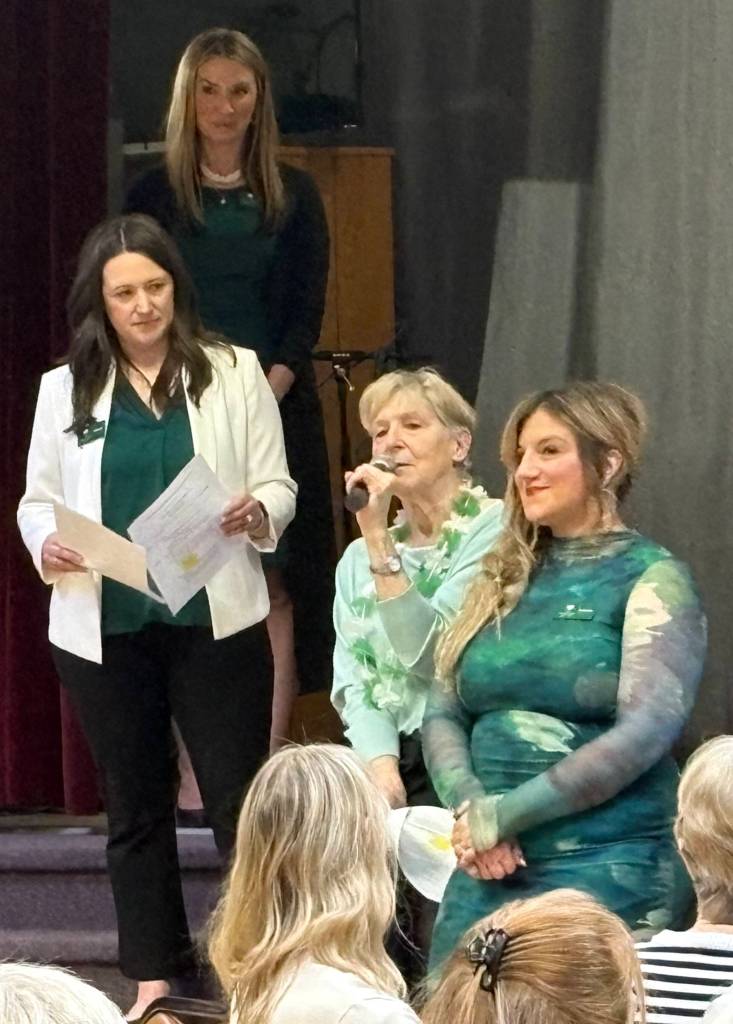 Founder Maryann Welch addresses the audience at the 100+ Harbor Women Who Care March 2026 giving event.