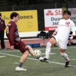 RYAN SPARKS | THE DAILY WORLD Montesanos Terek Gunter (left) and Hoquiams J.B. Fabian meet at the ball during the Bulldogs 6-4 season-opening win on Thursday in Montesano.