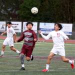 RYAN SPARKS | THE DAILY WORLD Montesanos Cris Tobar (10) and Hoquiams Josue Osorio chase after a bouncing ball during the Bulldogs 6-4 season-opening win on Thursday in Montesano.