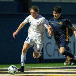 PHOTO BY FOREST WORGUM Elmas Ian Ahlquist (left) is pursued by Aberdeens Angel Corona during the Bobcats 3-1 win on Thursday at Stewart Field in Aberdeen.