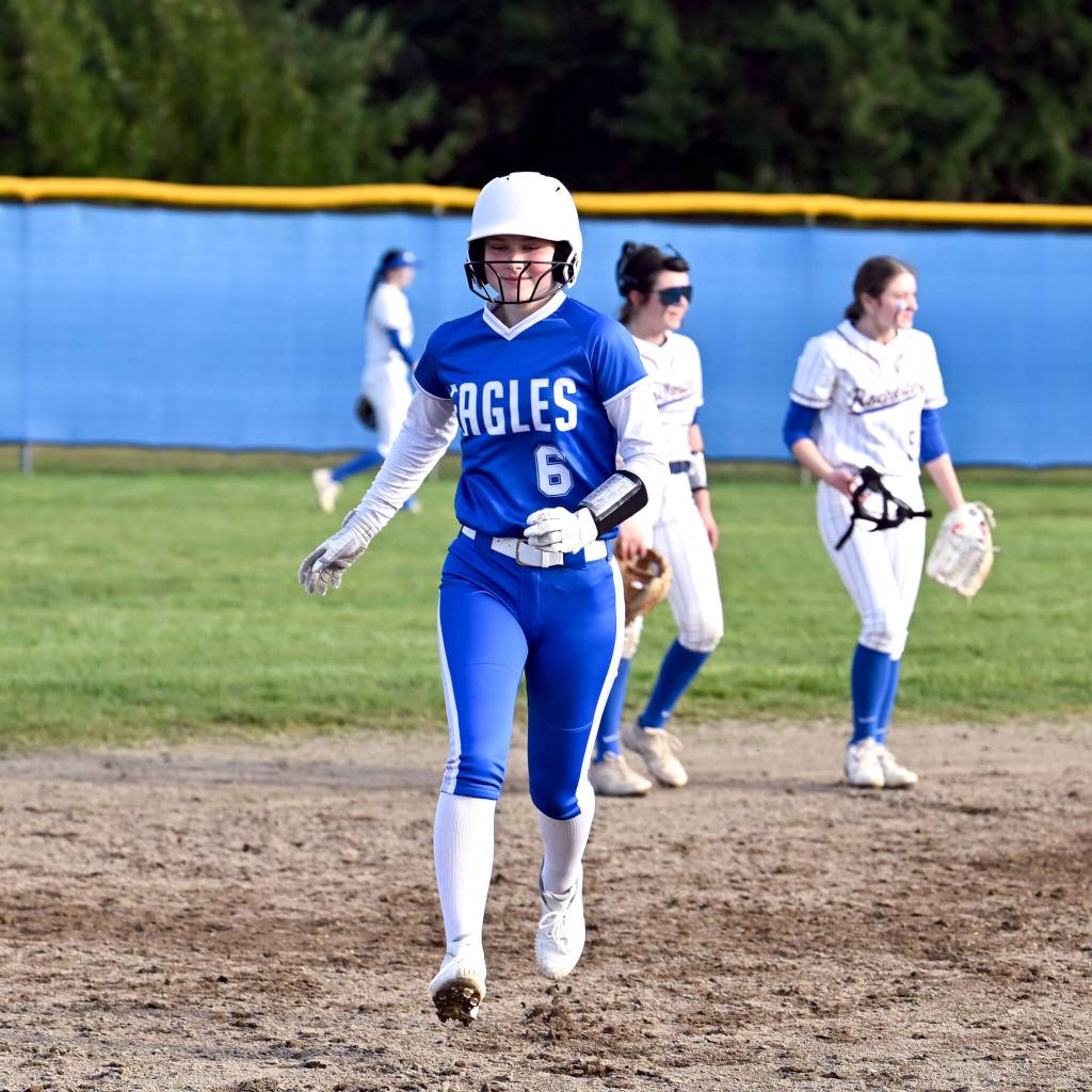 CHRYSTAL WELD PHOTOGRAPHY Elmas Sophia Jones (6) smiles after hitting a home run during a 14-0 win over Rochester on Monday at Rochester High School.