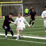 RYAN SPARKS | THE DAILY WORLD 
Aberdeen defender Edgard Ceja (left) plays the ball forward against Kelsos Elijah Fias during the Bobcats 3-1 win on Wednesday at Stewart Field in Aberdeen.