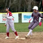 RYAN SPARKS | THE DAILY WORLD Montesanos Taylor Galvin (right) reaches second base while Hoquiams Kada Richardson awaits a throw during the Bulldogs 16-0 win on Monday in Hoquiam.
