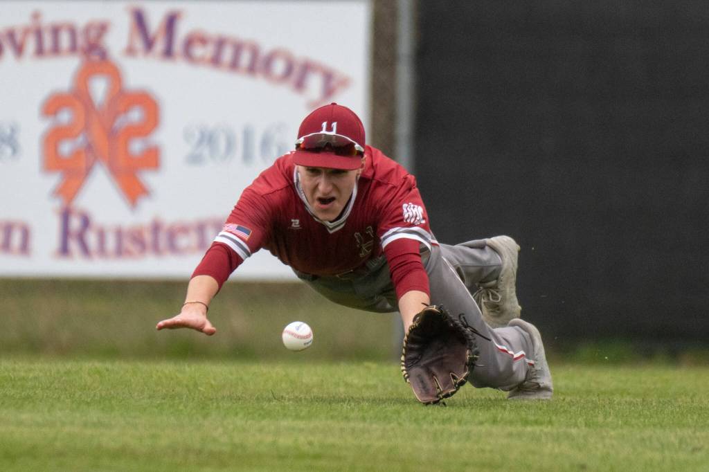 PHOTO BY FOREST WORGUM Hoquiam outfielder Danton Cole dives for ball during a loss to Elma on Monday at the Elma Ballfields.