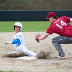 NICOLE SHANNON | MAIN FOCUS MEDIA Elmas Troy Rupe (left) slides in ahead of the tag by Hoquiams Ty Thao during the Eagles doubleheader sweep over Hoquiam on Monday in Elma.